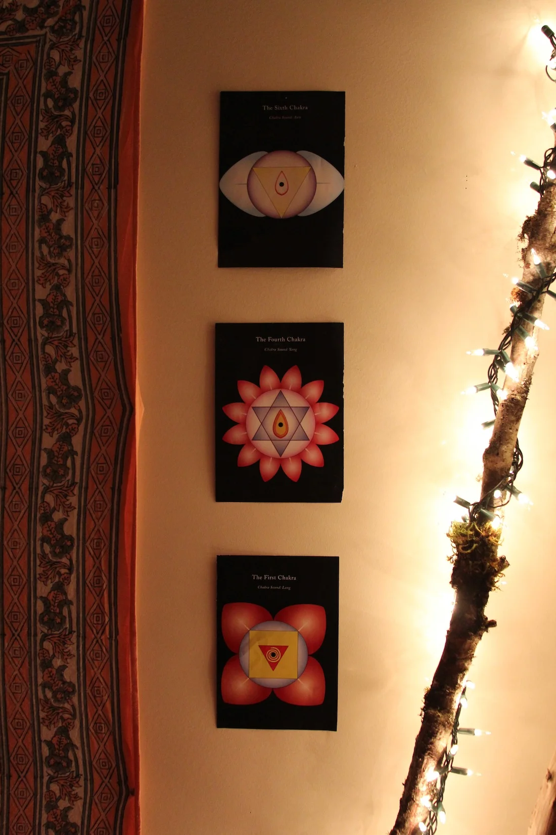 The symbols for the root, heart, and third eye chakras add power to the space