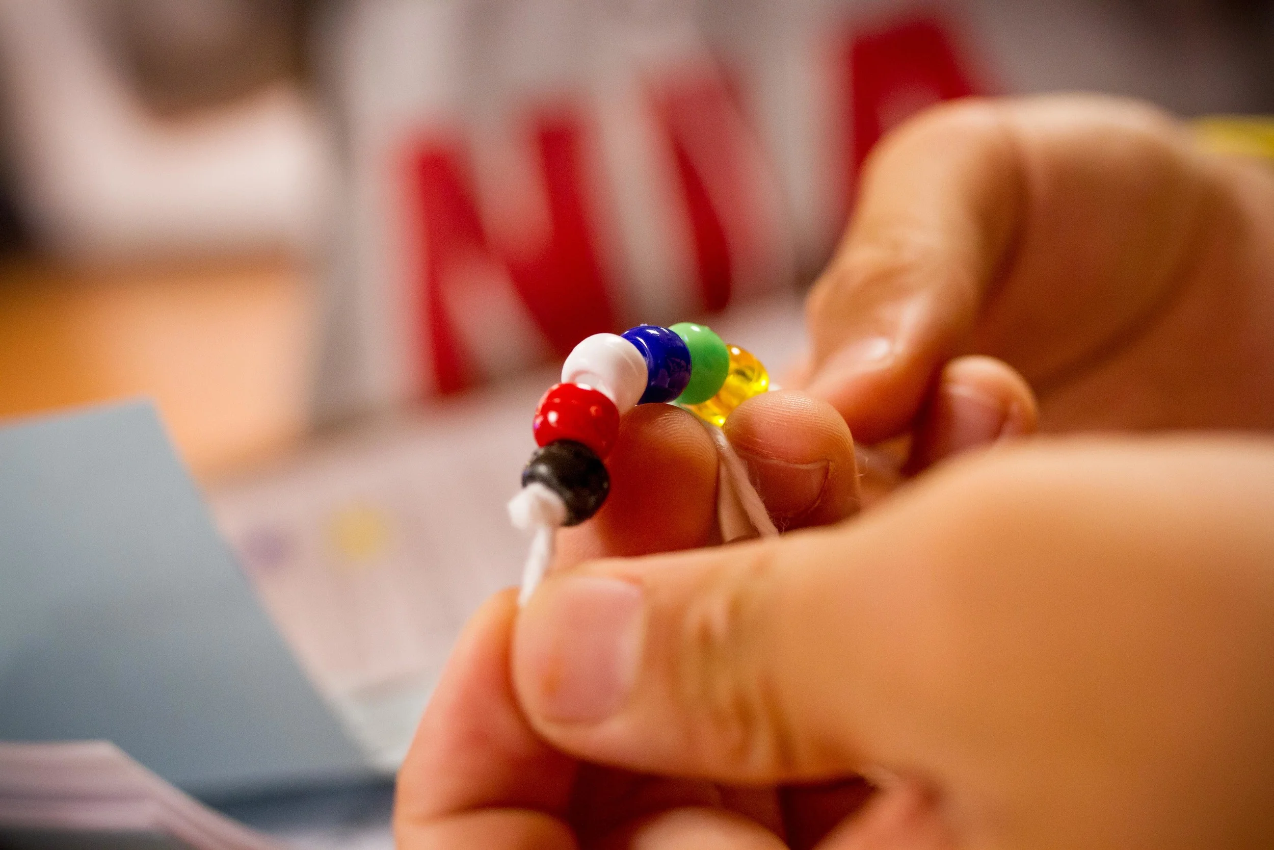 The different colored beads represent various milestones in our lives. For example, the red represents the blood of Jesus shed on the cross for us, and the white represents the new life we have in Christ!