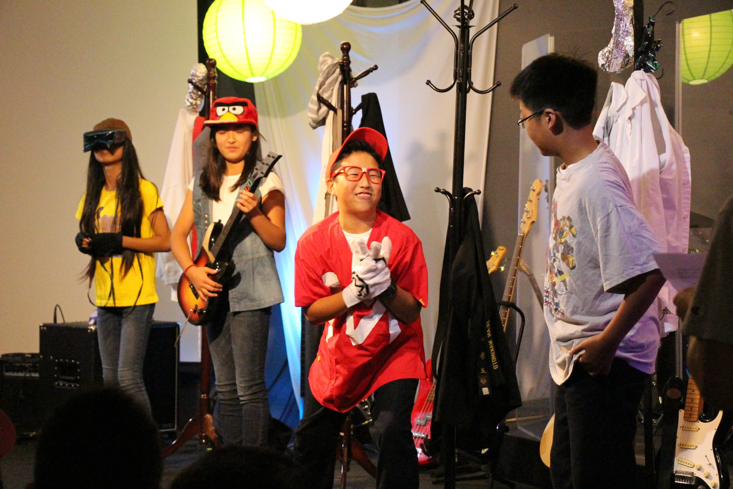 Our students then performed a skit about 4 very accomplished middle schoolers (a fashionista, a tai-chi champion, a student council activist, and a world-class gamer) who think they've made it to the top. But at the end of the day, our heroes all feel frustrated and dissatisfied with what they've done to try to fit in, and start to wonder if their friends know something that they don't.