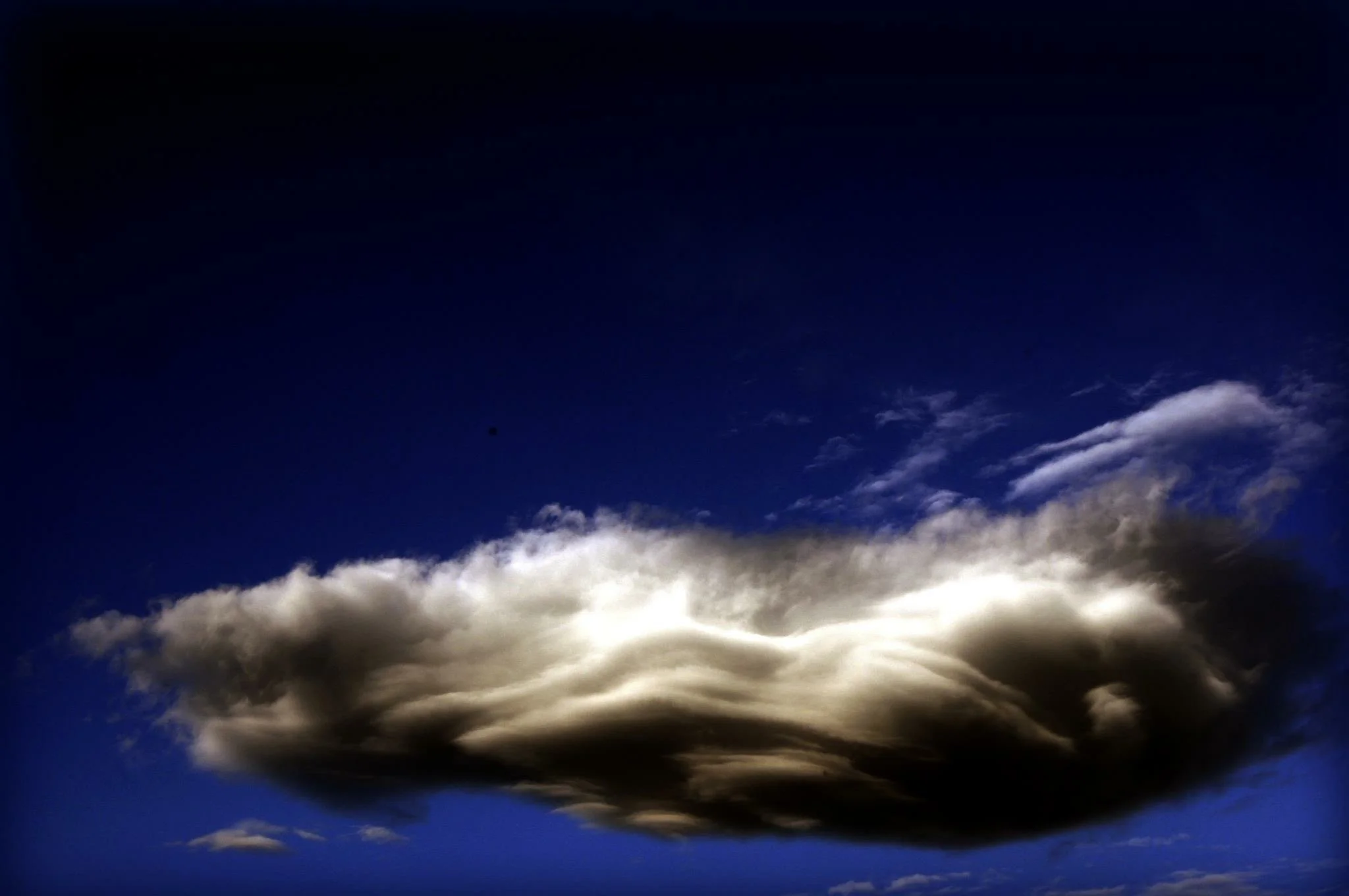 lone cloud resting in its beauty
