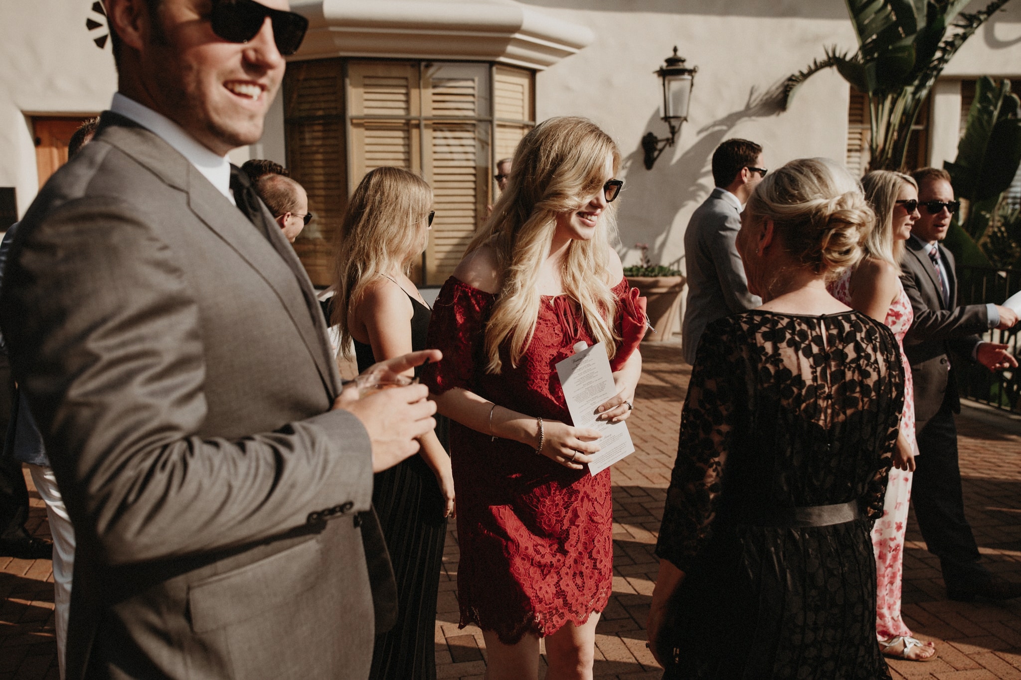 Guests mingle before an outdoor wedding ceremony at The Resort at Pelican Hill on the Newport Coast.