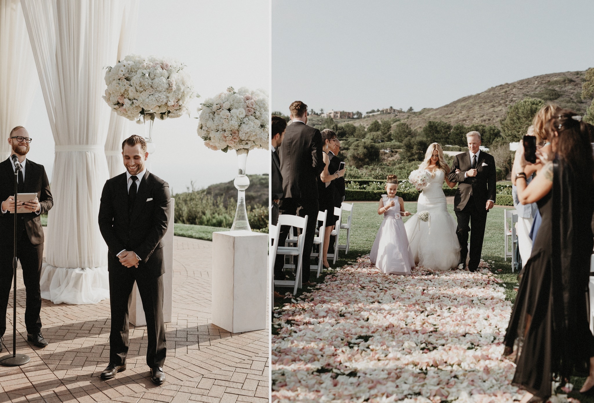 A handsome groom in a black suit smiles and looks down as he waits at the alter for his bride at an outdoor wedding in Orange County.