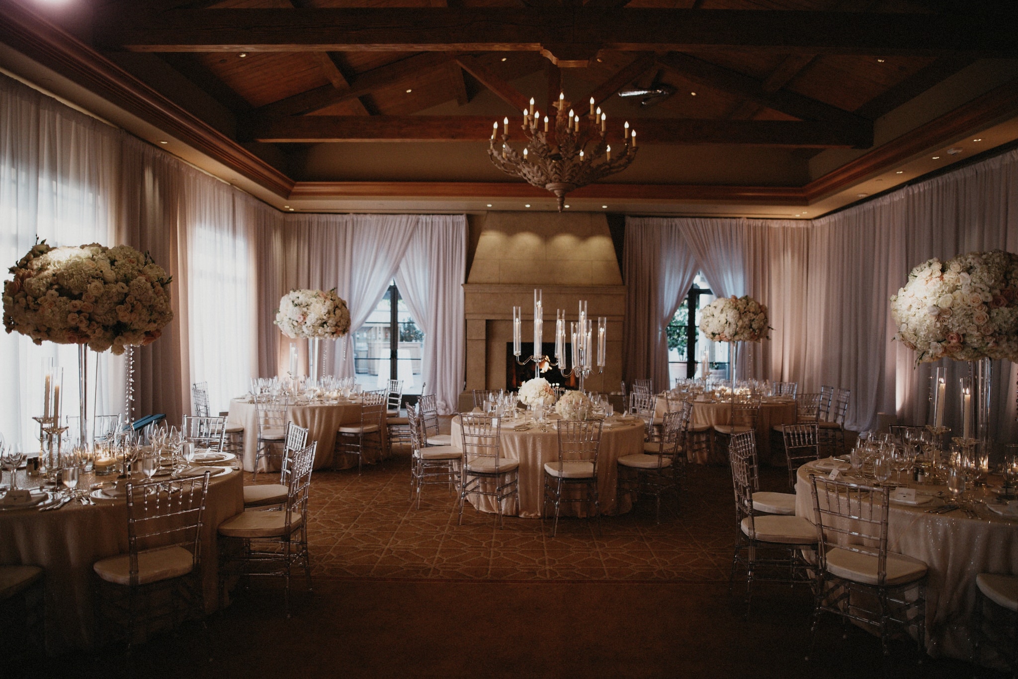 Elegantly set, round tables during a wedding reception at Pelican Hill Resort in Orange County.