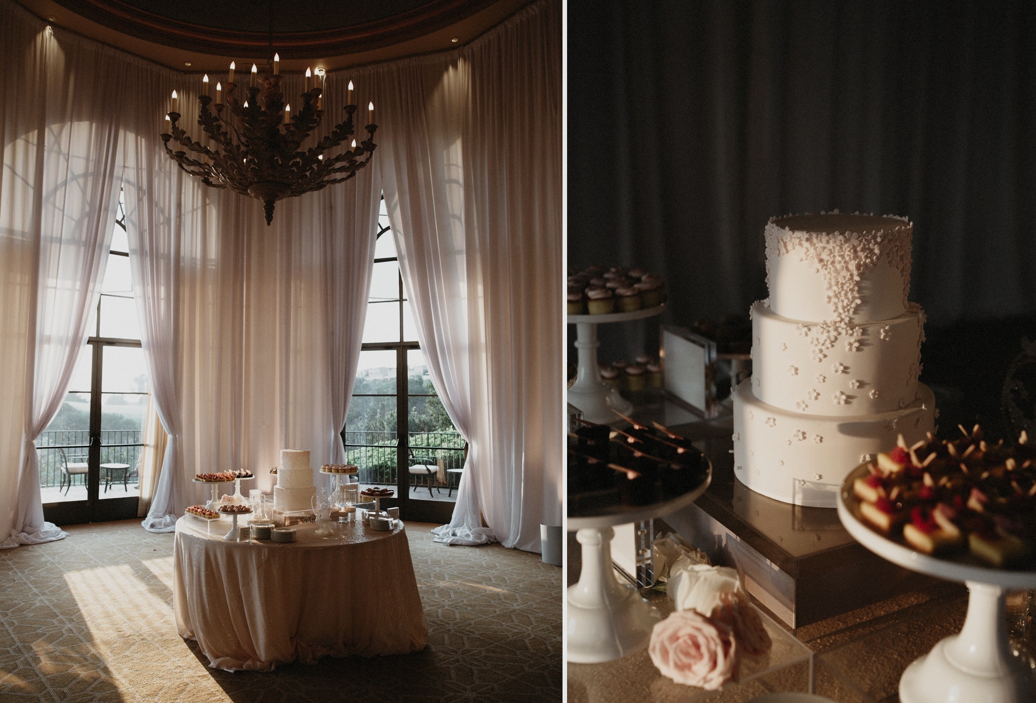 A table at an elegant wedding at The Resort at Pelican Hill with the wedding cake and treats sits before large windows with long white drapes.