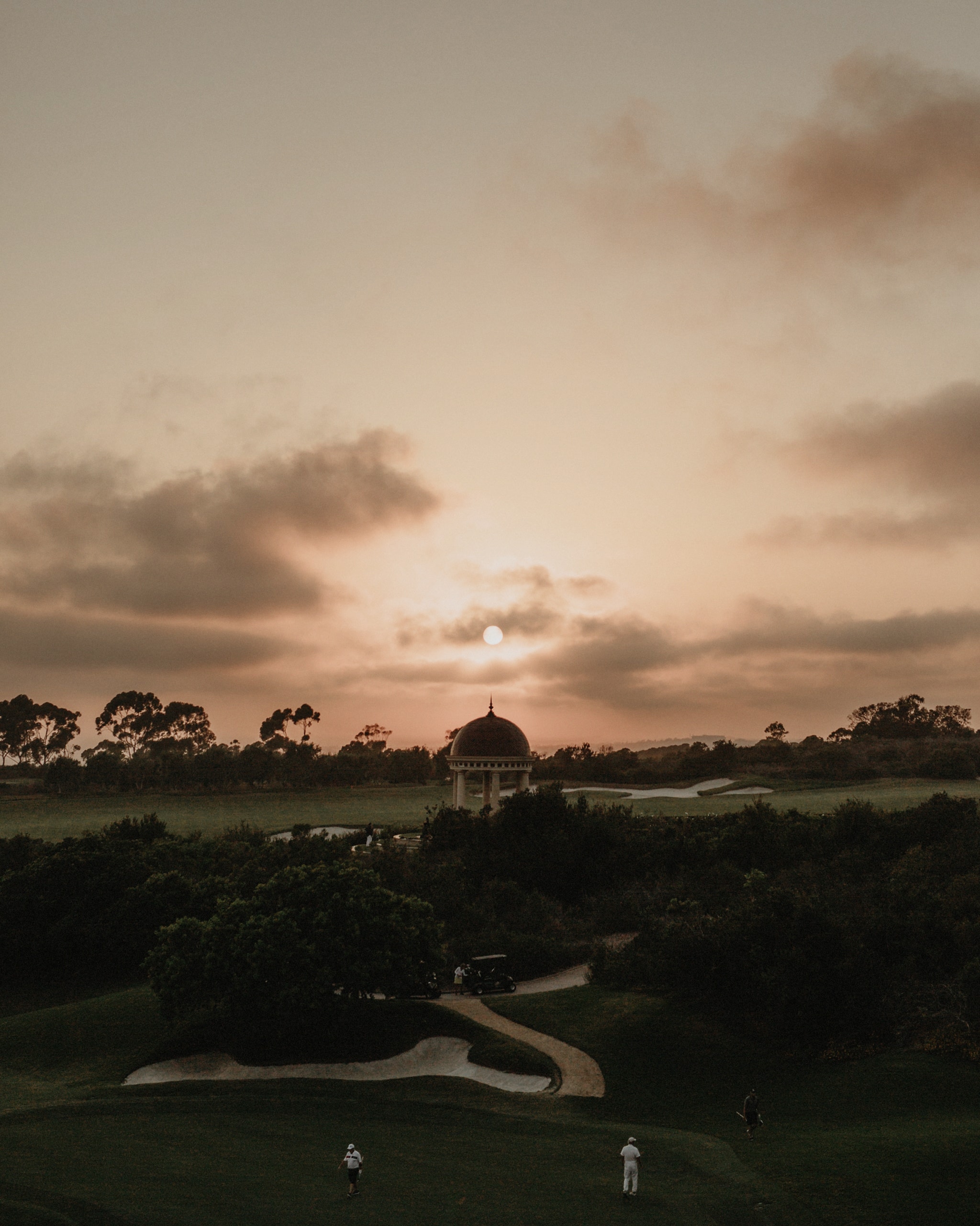 The sun setting over the golf course outside of Pelican Hill Resort during an intimate wedding.