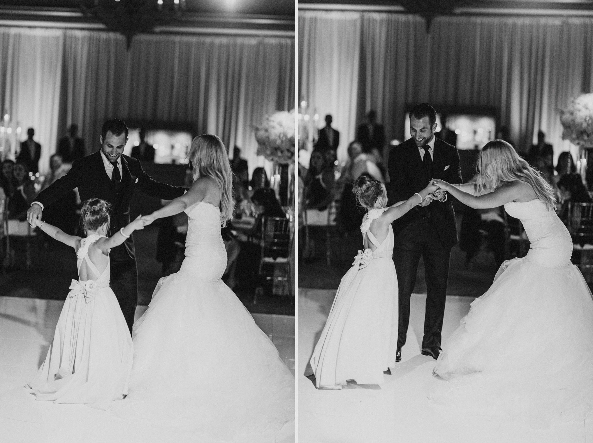 A bride and groom dance with the flower girl at their beautiful wedding reception at Pelican Hill Resort.