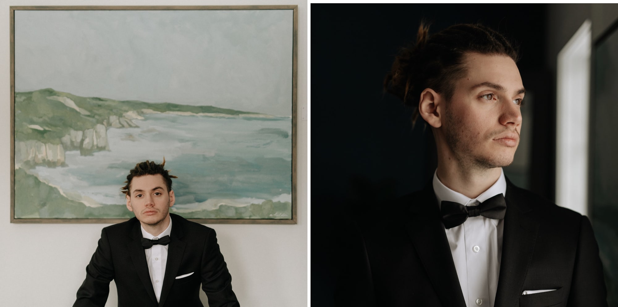 A handsome man with dreadlocks tied up in a bun wearing a black tuxedo sits in front of a landscape painting in Minneapolis.