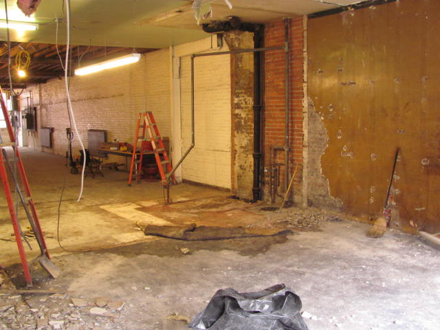 We have a little section of exposed brick. Watch it grow until the wall is all exposed.