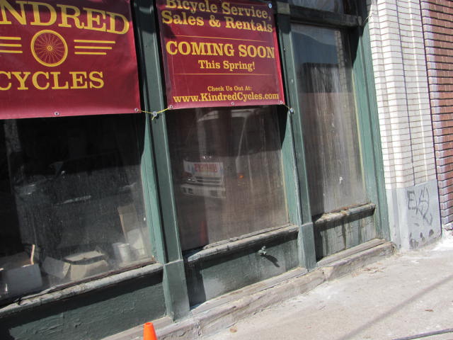 The storefront is old and dirty. It's time to get some paint up.
