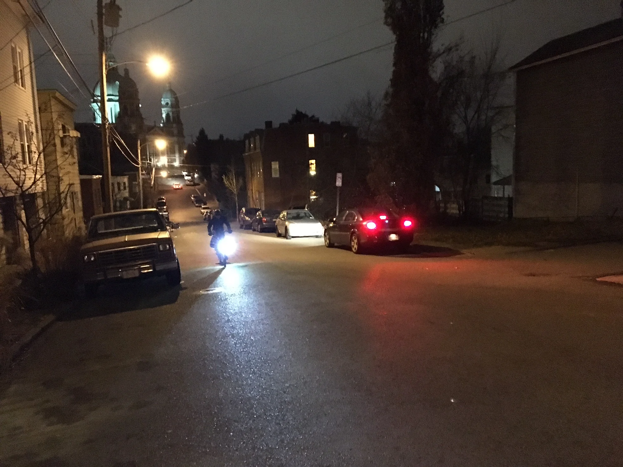 Here is a picture I snapped of Katharine riding through Polish Hill on one of our nightly commutes. The beam of her Busch and Muller Cyo T premium dynamo headlight is incredibly eye catching. The very bright beam is carefully managed to provide excellent illumination while not to blinding motorists as per German safety regulations. The light also has a daytime running feature that can sense light or dark and can alter the beam accordingly.
