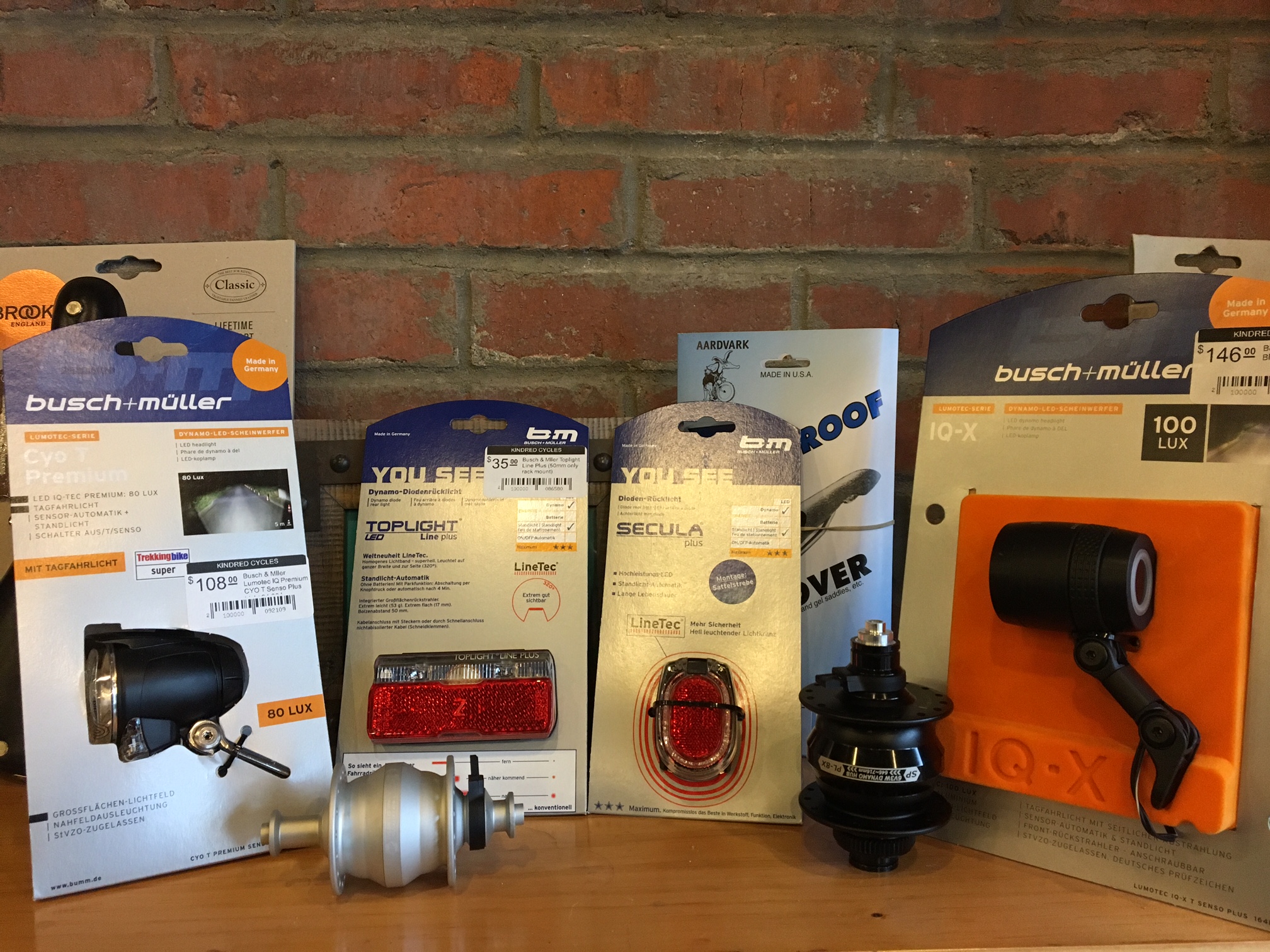 Here are some of the Dynamo products we keep in stock here at the shop. Most of the lights we carry are from Germany, where until 2013, all bikes over 11kg legally had to have a dynamo lighting systems to be in compliance with the law. Now battery powered lights are legal but Dynamos still rule the roost in Germany and much of Europe.