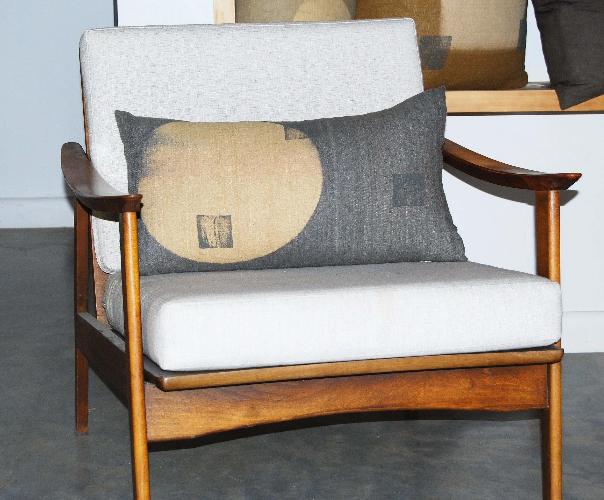  Silk lumbar pillow on mid-century modern chair. 
