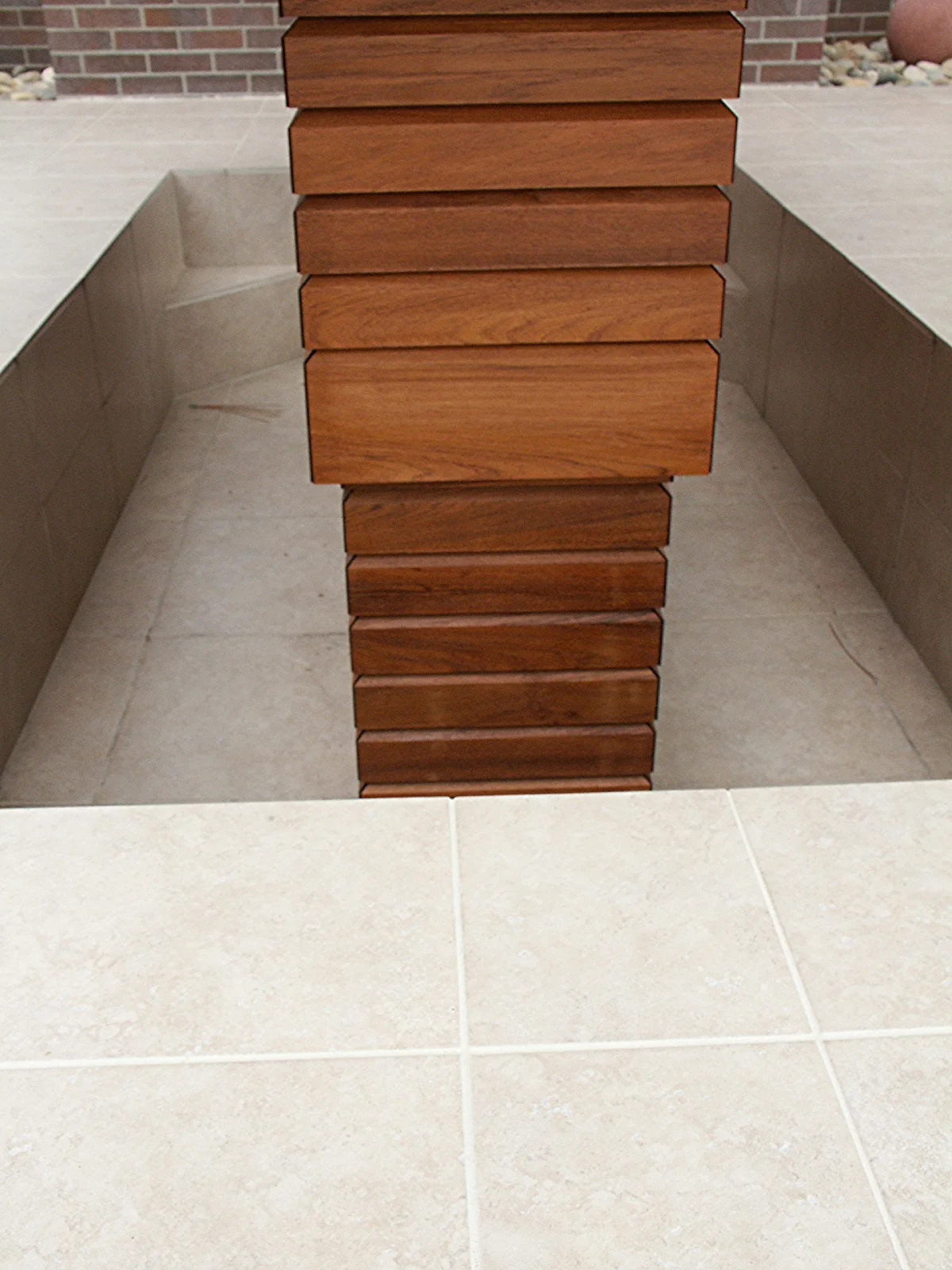 End View of outdoor, remote-control adjustable walnut table