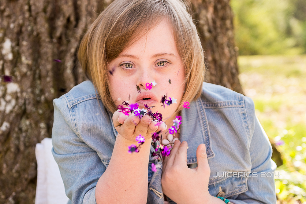 Cami blowing sweet 16 confetti