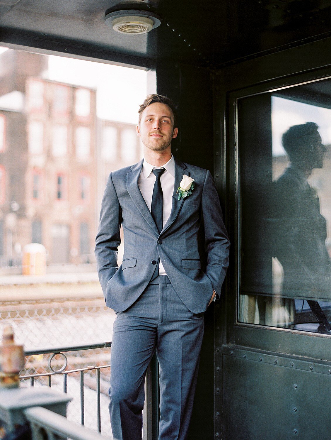 Groom portrait—subtle chin forward for defined jawline.
