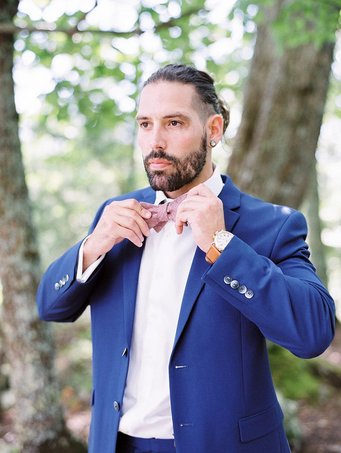 Bride’s chin proud—clean neckline for classic portrait.