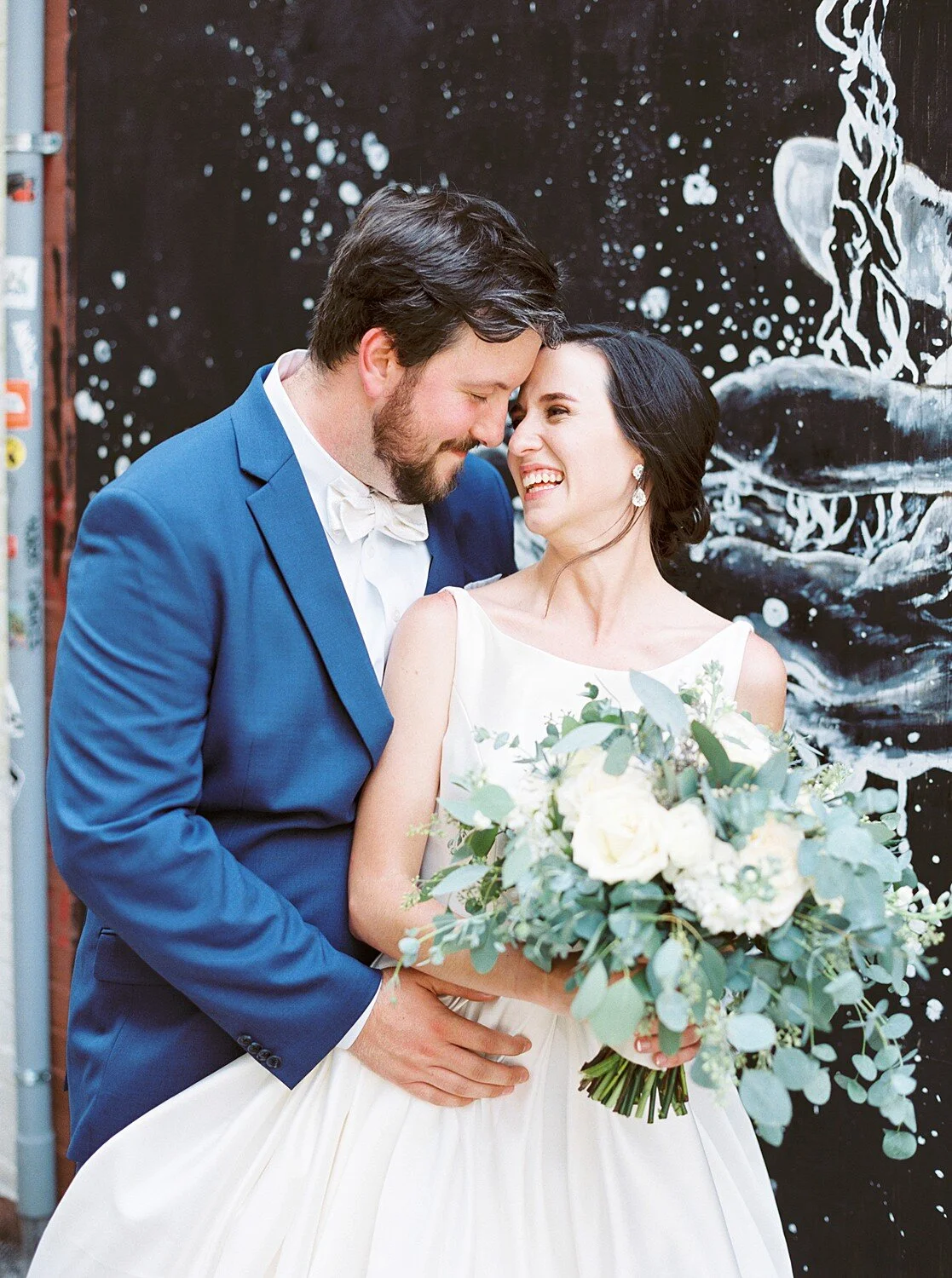 Close connection—heads angled, eyes softly down for intimacy.