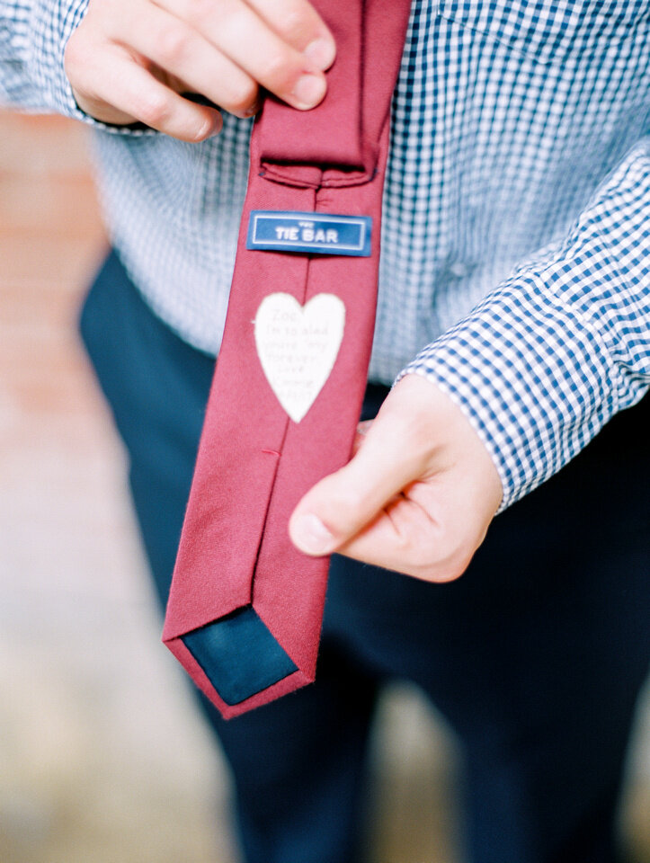 personalized touches on grooms tie