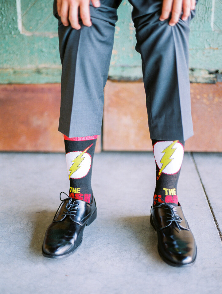 flash socks on groom