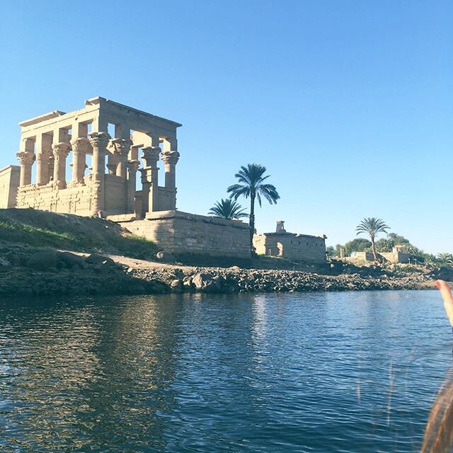 Philae Temple of the Goddesses Isis 𓆸𓁧𓁥𓆃.  Only accessible by boat. (Note me fellow travel goddess in the boat with me! @lara.nickel ). This sacred temple to the mother goddesses is filled with sorrow as it&rsquo;s the LAST Egyptian temple, the L