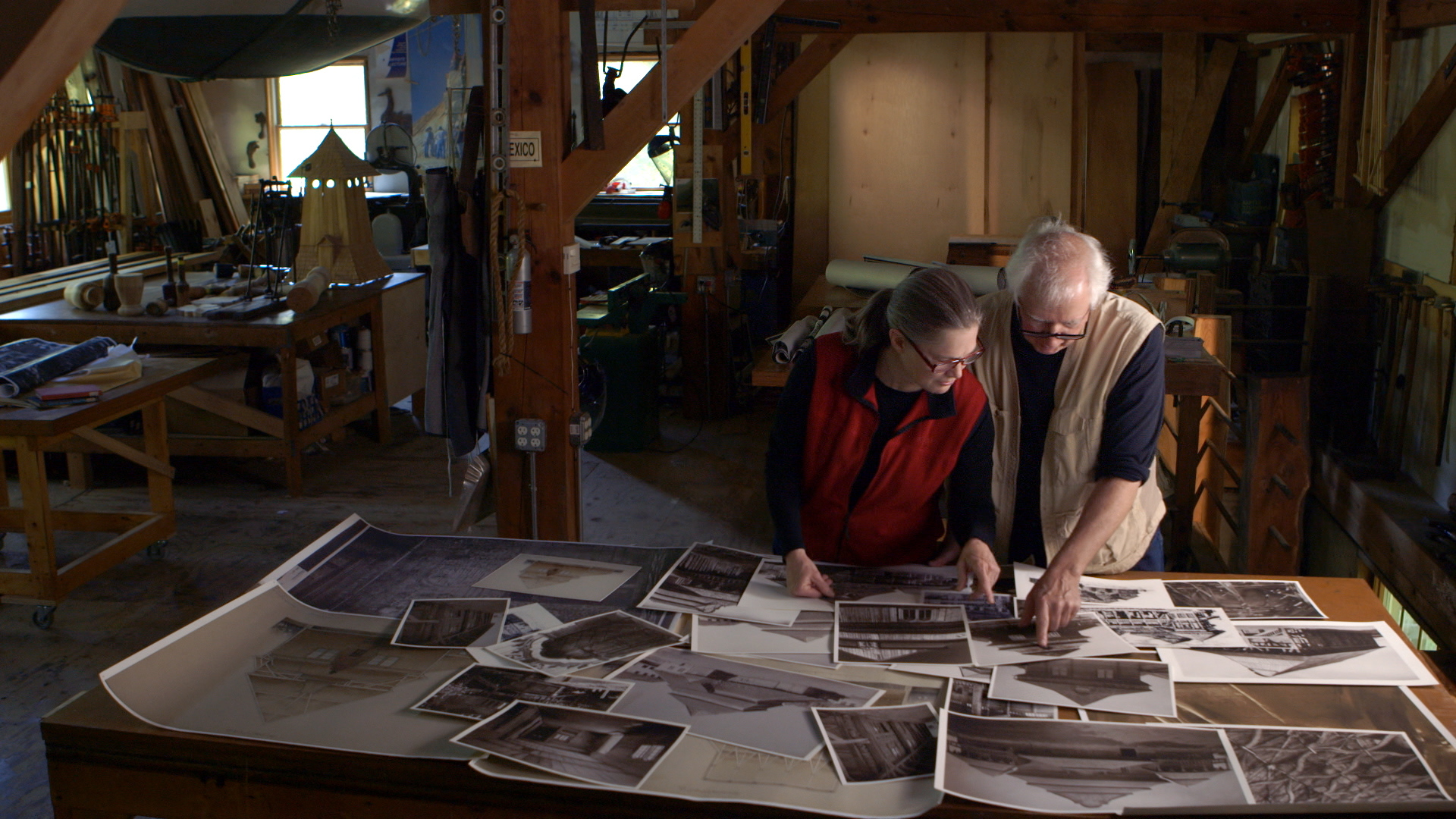 Still 2: Rick and Laura Brown review details on photographs of the Polish synagogues that no longer exist.
