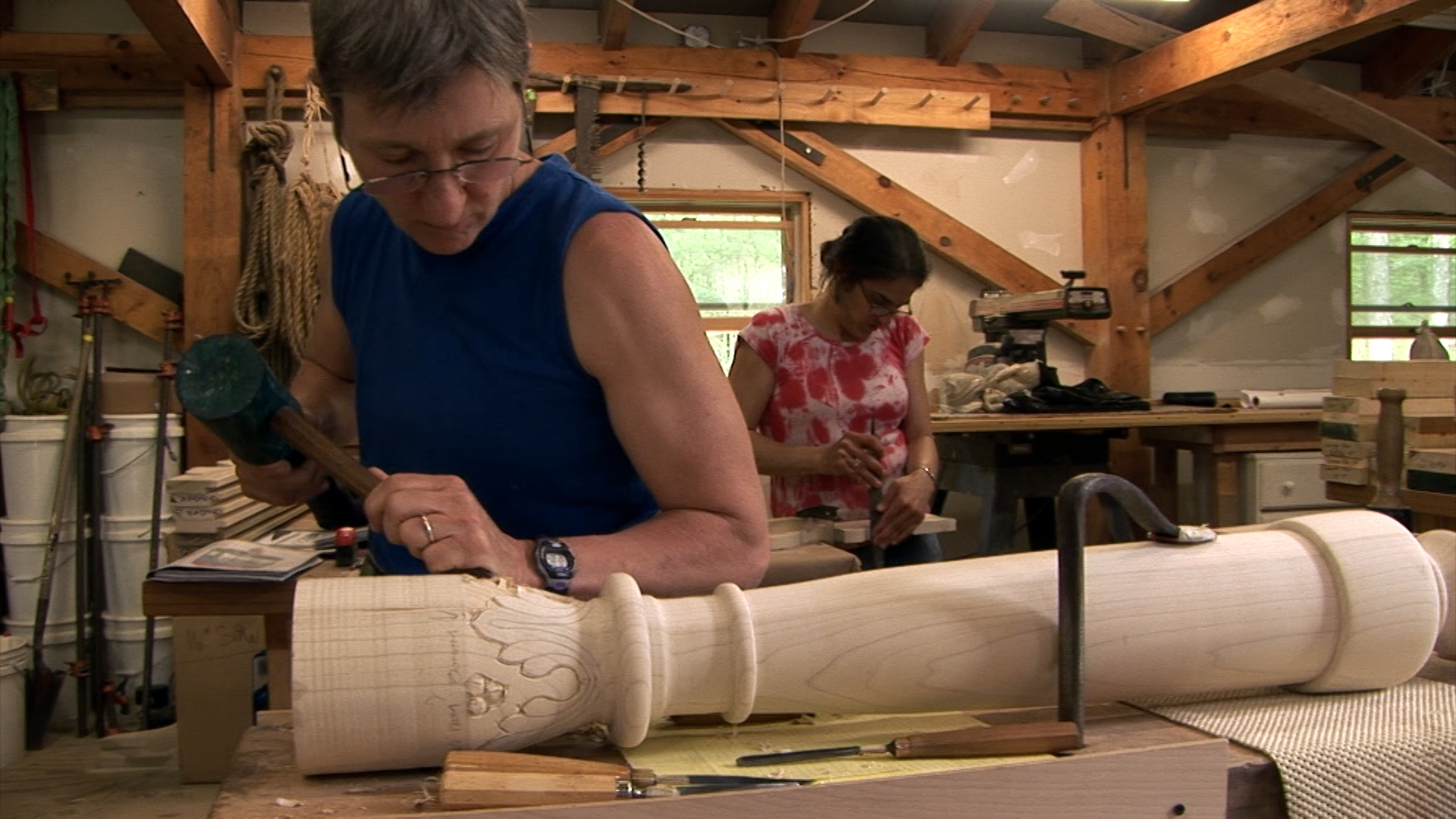 Still 3: Judith Hanson carves a post for the Gwoździec bimah.
