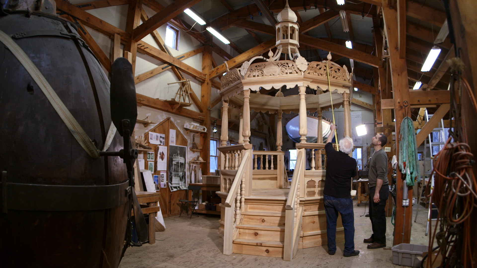 Still 5: Rick Brown and Jason Loik take measurements of the completed bimah in the studio at Handshouse.