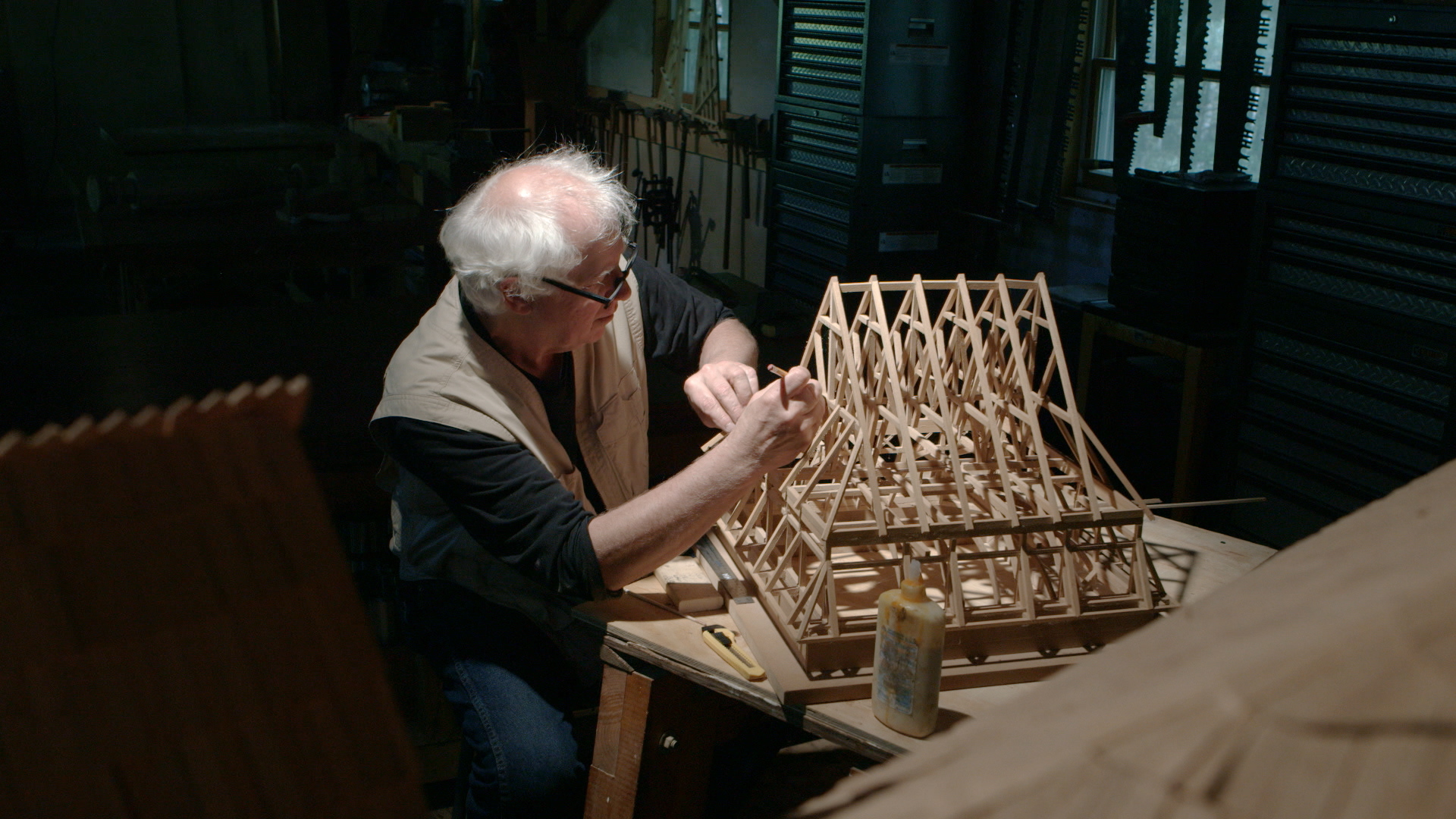 Still 9: Rick Brown puts finishing touches on the Gwoździec roof model.
