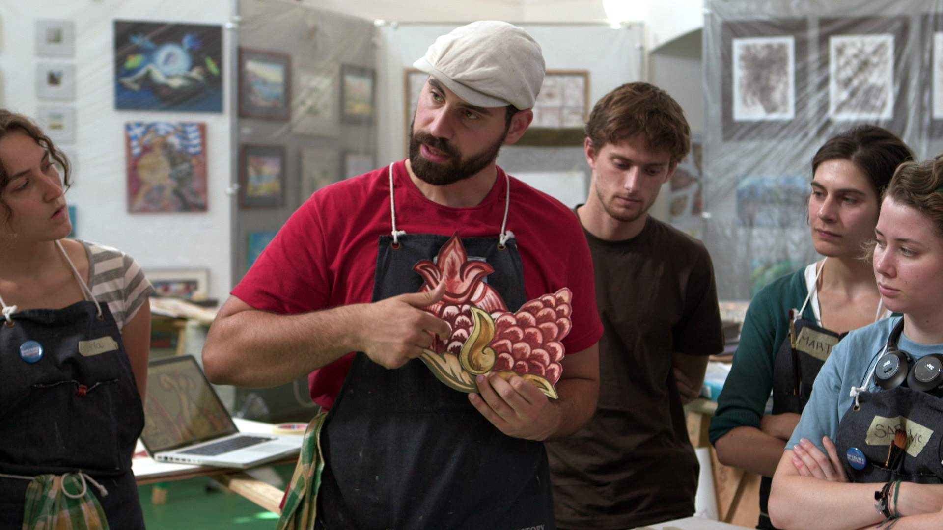 Still 31: Jason Loik explains the direction of the brush strokes on flowers.