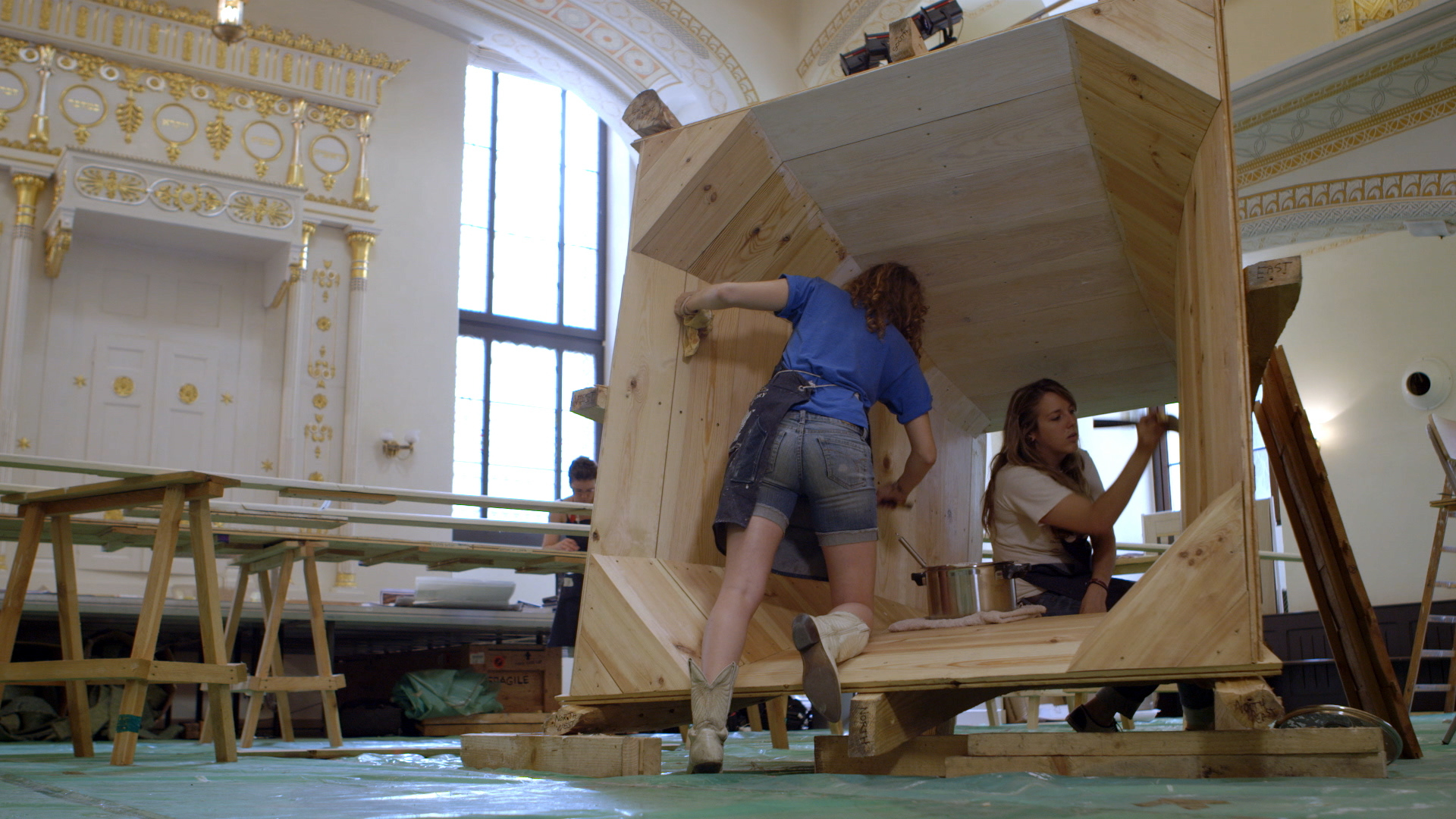 Still 35: Emily White and Krista Lima paint the interior of the lantern with gesso.