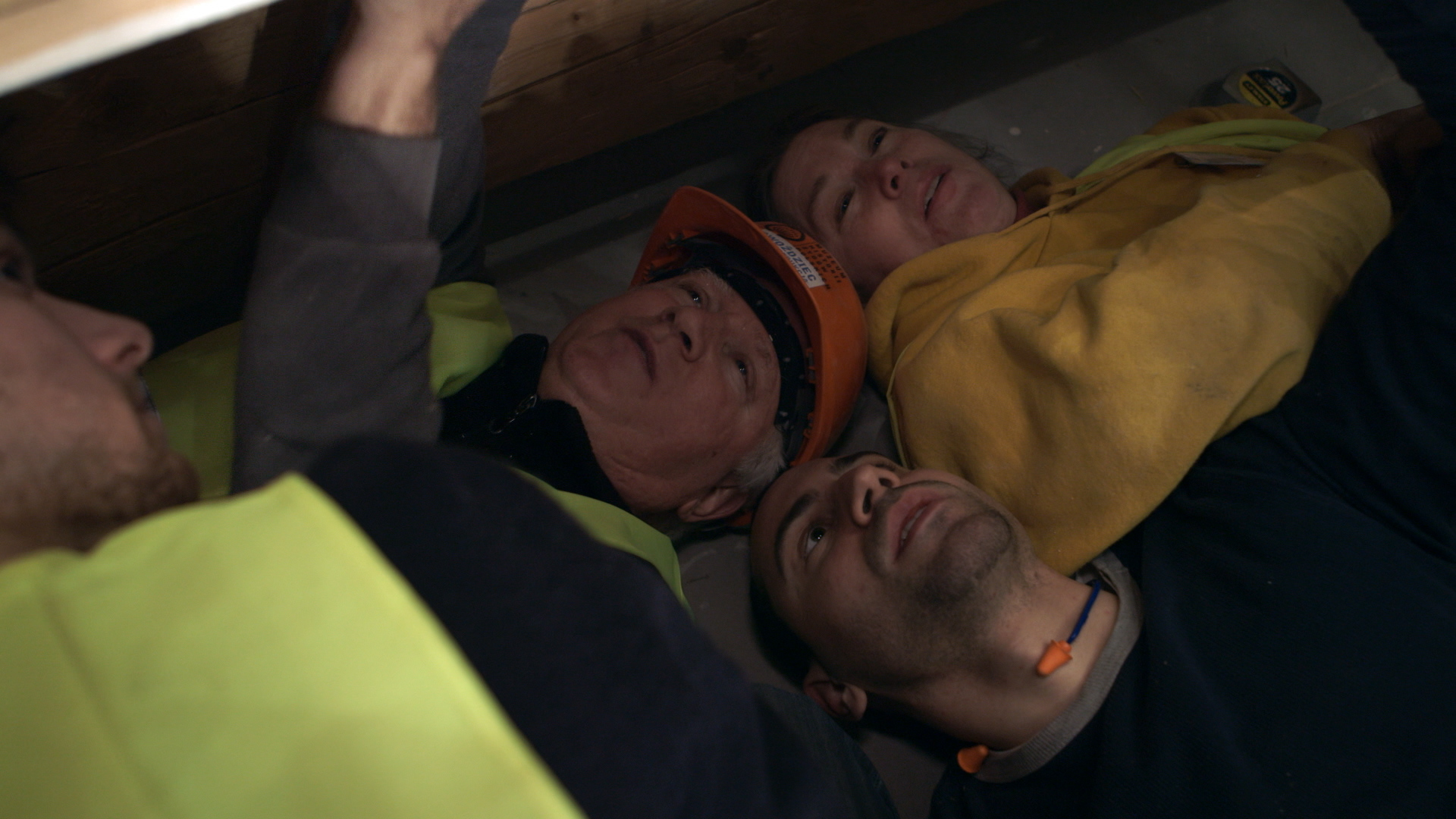 Still 39: Rick and Laura Brown and Jason Loik check the position and fit of the cove panels.