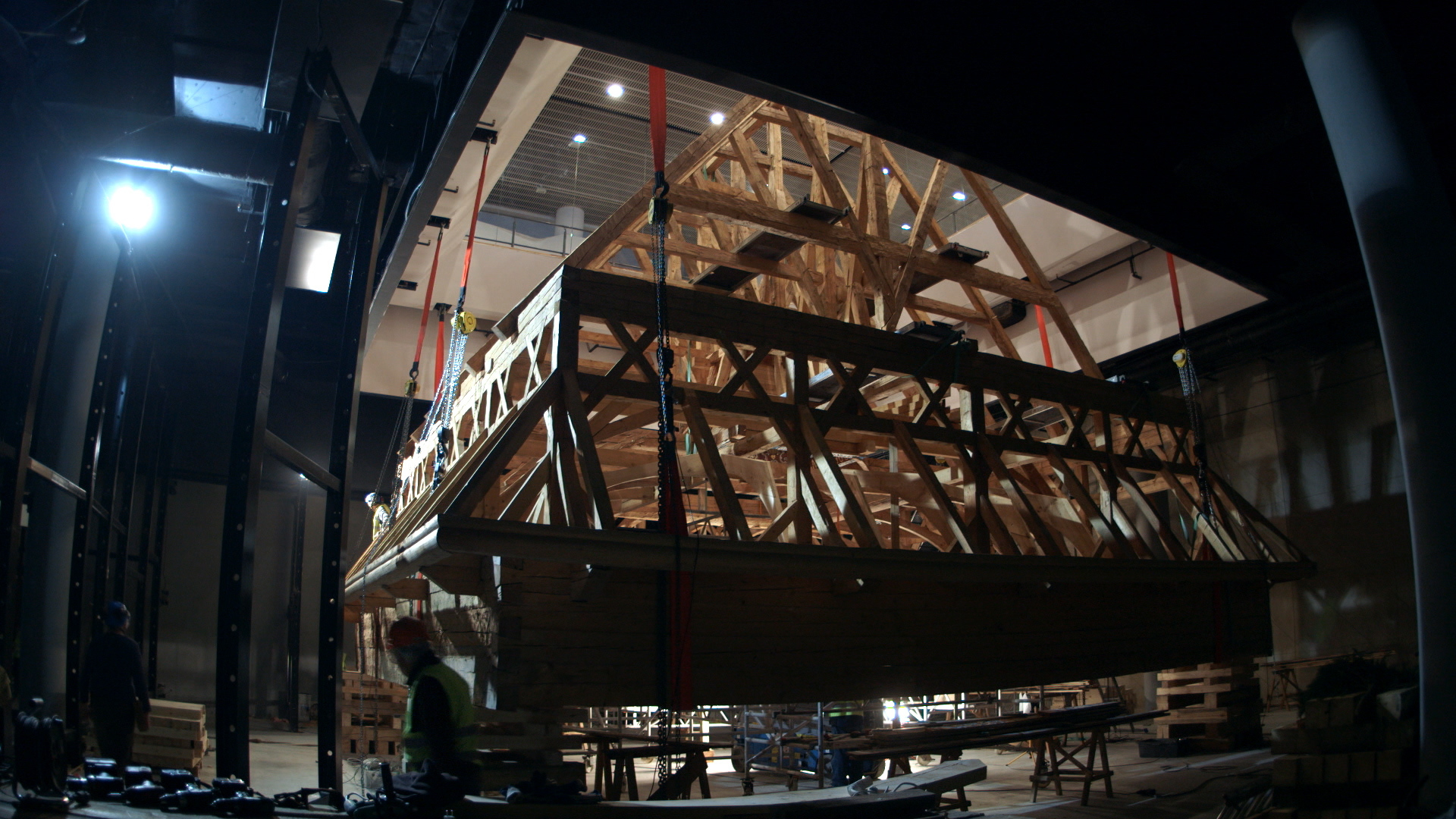 Still 43: The Gwoździec roof structure is hoisted into place using many chainfalls.