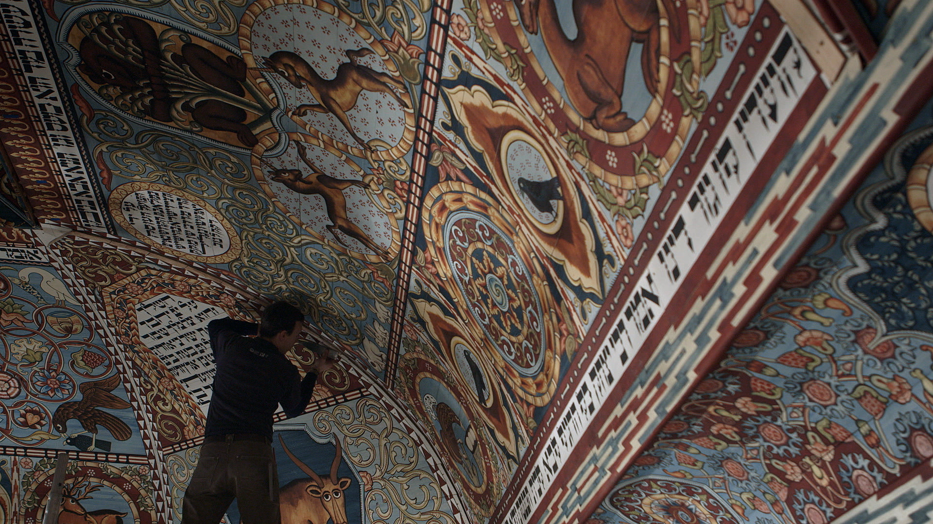 Still 45: Trim boards are attached on top of the seams between the dome and pendentive panels.