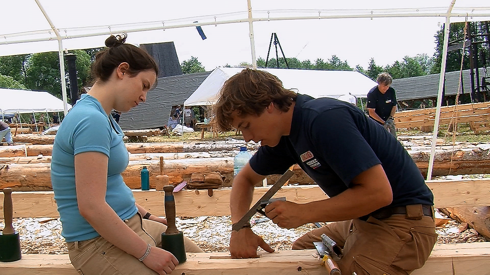 Still 18: Students carve a slot into a dimensional timber.