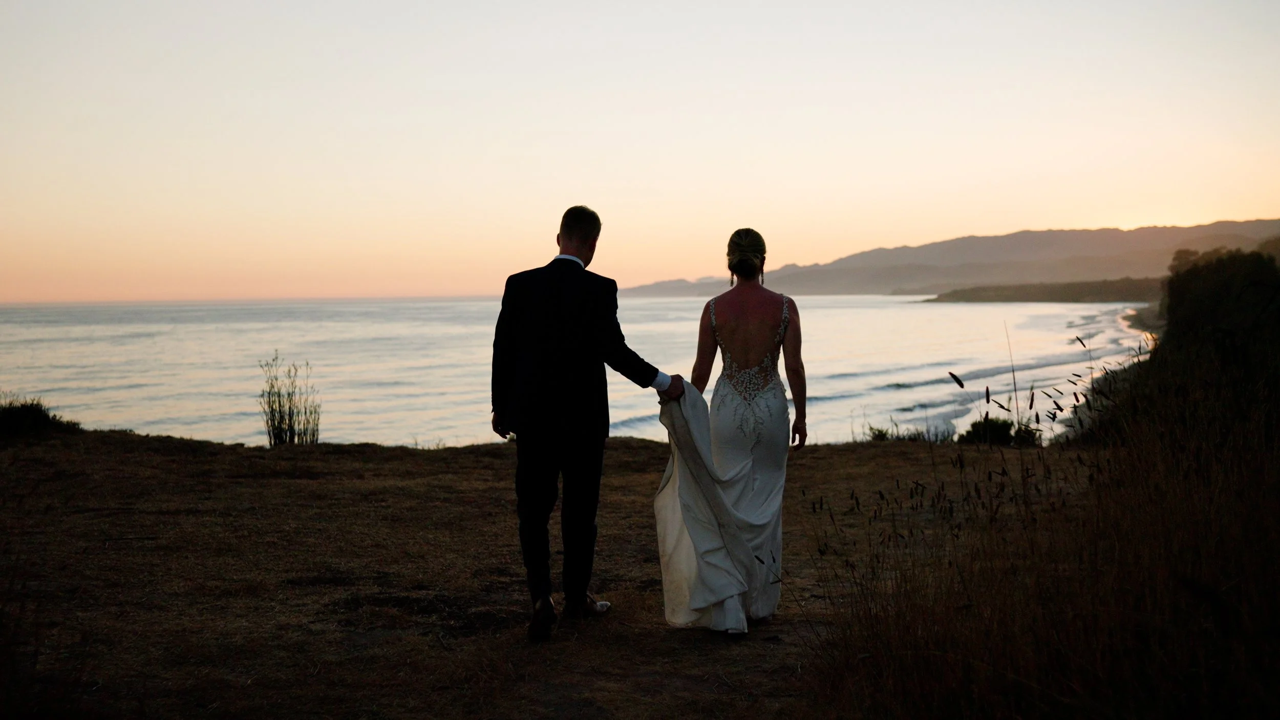 silhouette walking to edge of cliff.jpg