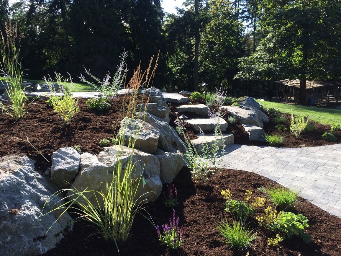 Boulder steps connect the upper and lower patios.