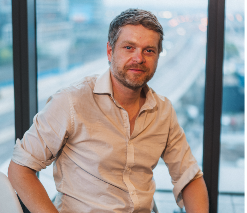 Blake Anderson, RSW, seated beside a window