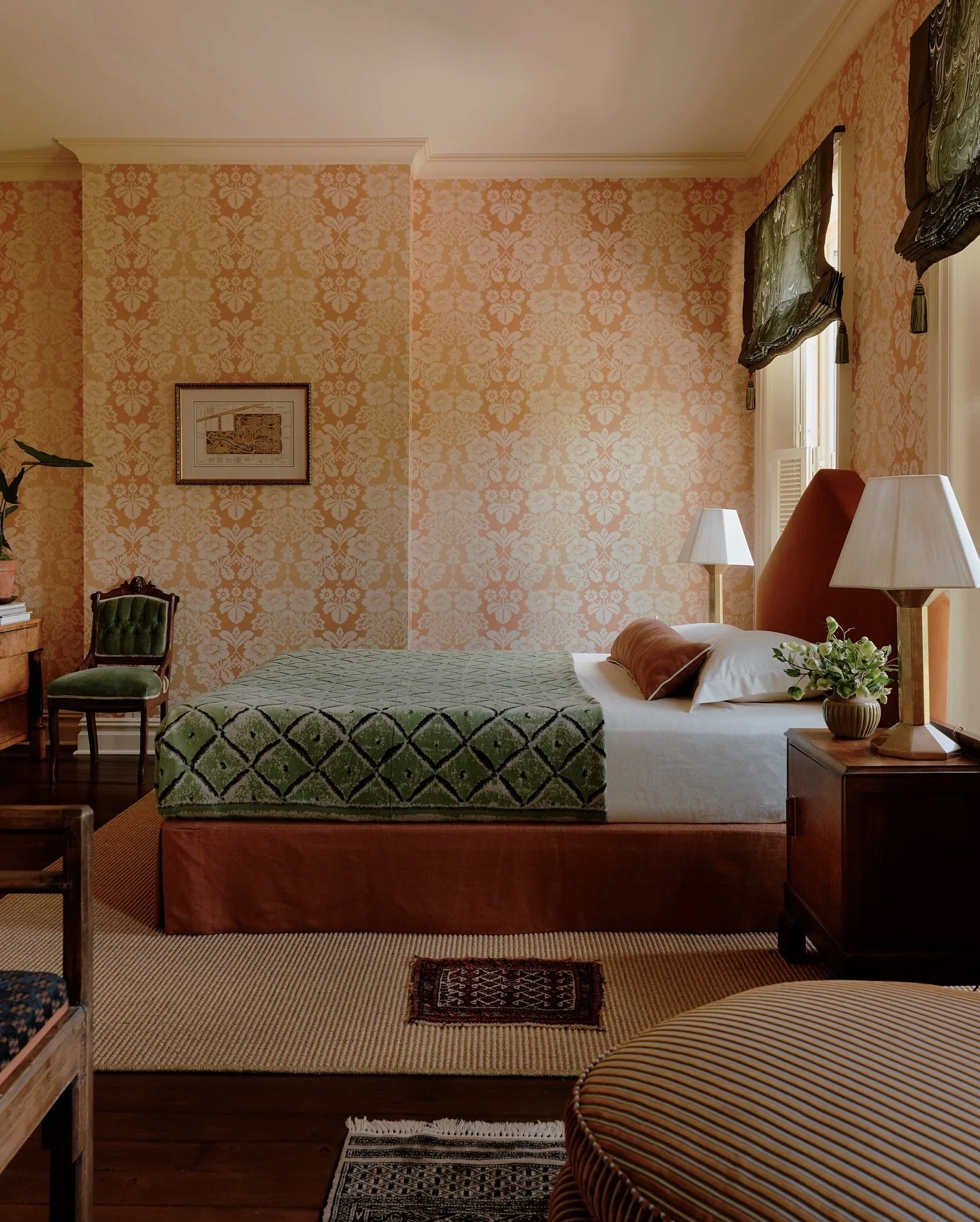 The guest bedroom in our Albany project is bananas (🍊) and I love it. Our client found rolls of vintage Brunschwig &amp; Fils wallpaper at an estate sale and my answer was to double down on the crazy&mdash;emerald sheers, stepped library chairs, gro