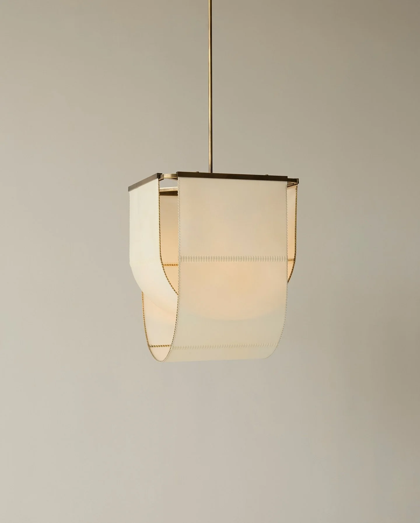 Our Michel pendant, made entirely in New York, shown in aged brass with a natural goatskin shade stitched by hand over the course of ten hours. Architectural but soft, natural and uncomplicated 🤍