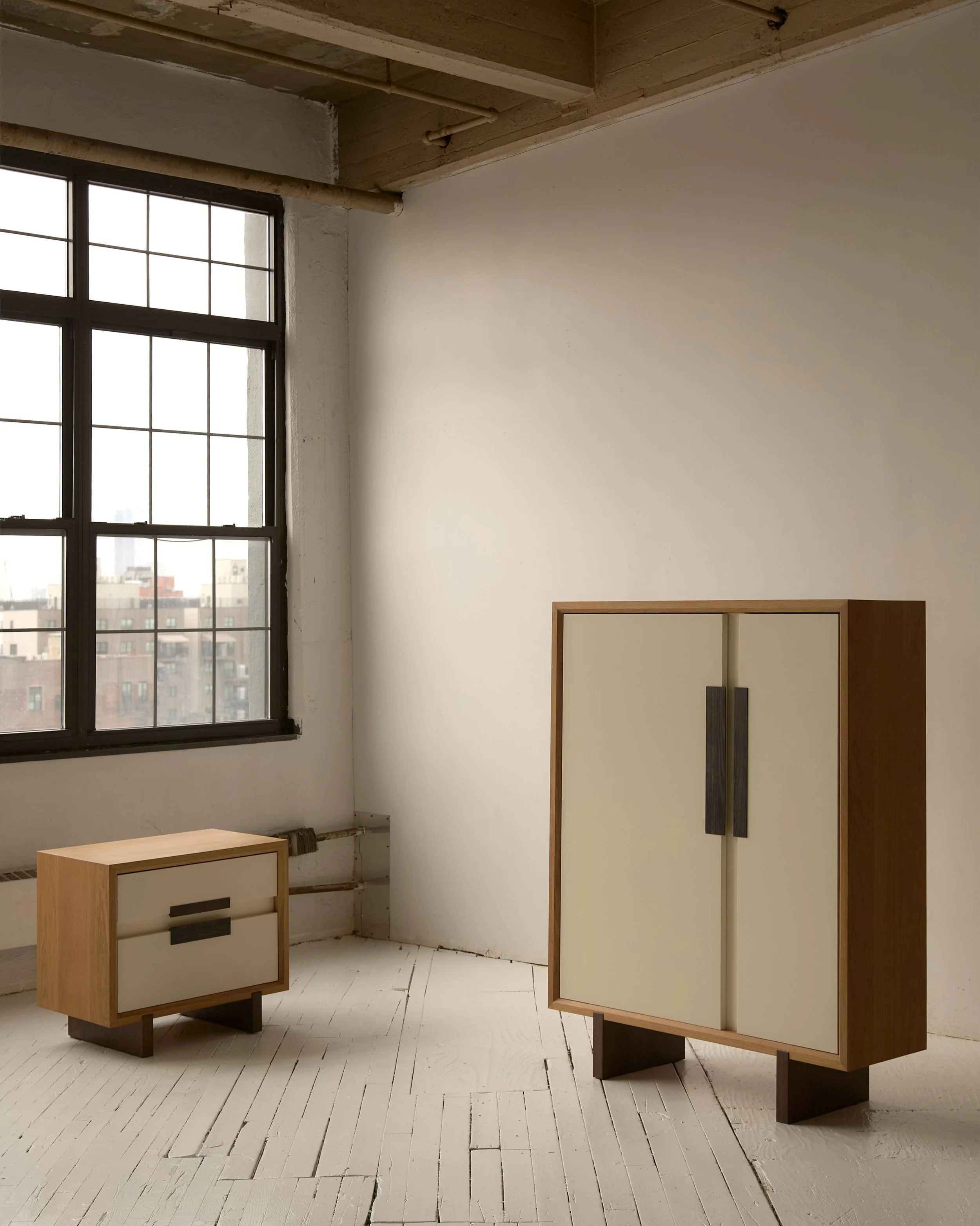 Introducing our Frank cabinet and side table, out today @archdigest. Asymmetrical doors in ivory lacquer, solid white oak with a cerused finish and chocolate cerused oak details.

We are proud to make these in Los Angeles, humbled daily by the knowle