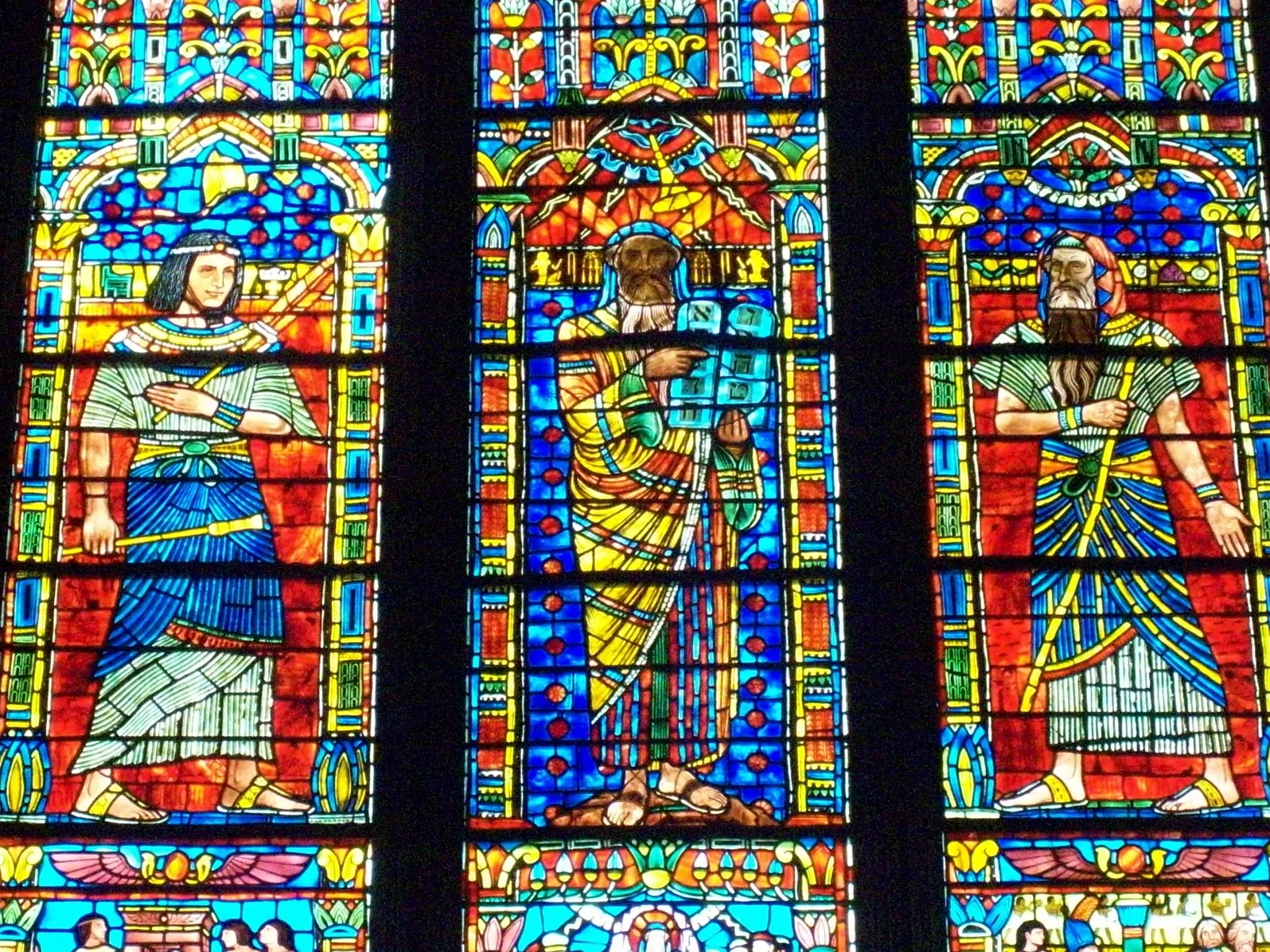Photograph taken at the Washington National Cathedral of the Moses window by Lawrence Saint This window depicts the three stages of the life of Moses, each of them being 40 years long. The first 40 years is depicted in the left panel, when Moses is …