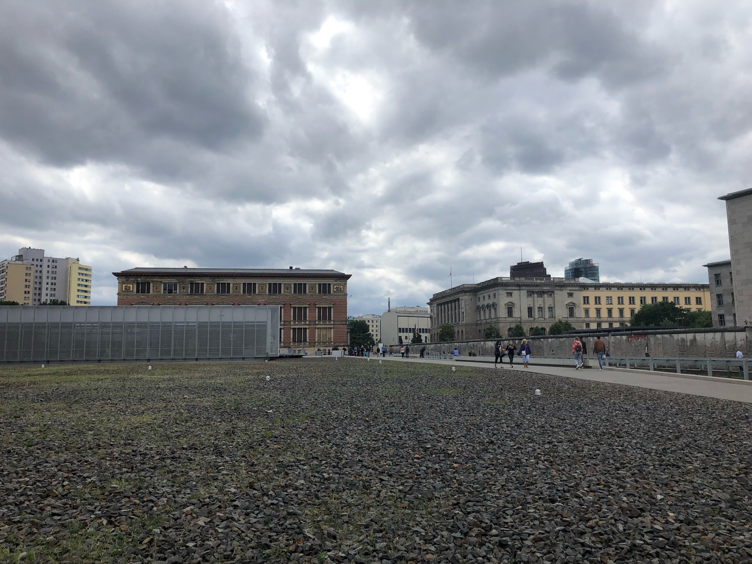  The lower silver building is the Topography of Terror. This location houses the headquarters of the Gestapo. Here you can also see a part of the Berlin Wall, and simultaneously view East and West Berlin.&nbsp; 