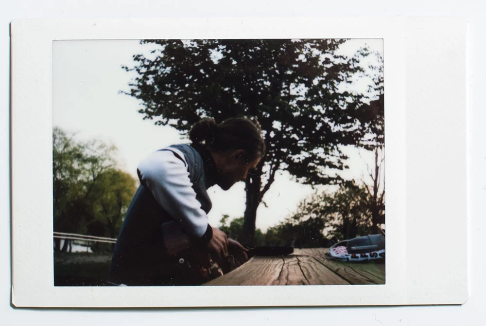 Sio tuning his guitar during one of our last vlogs. 