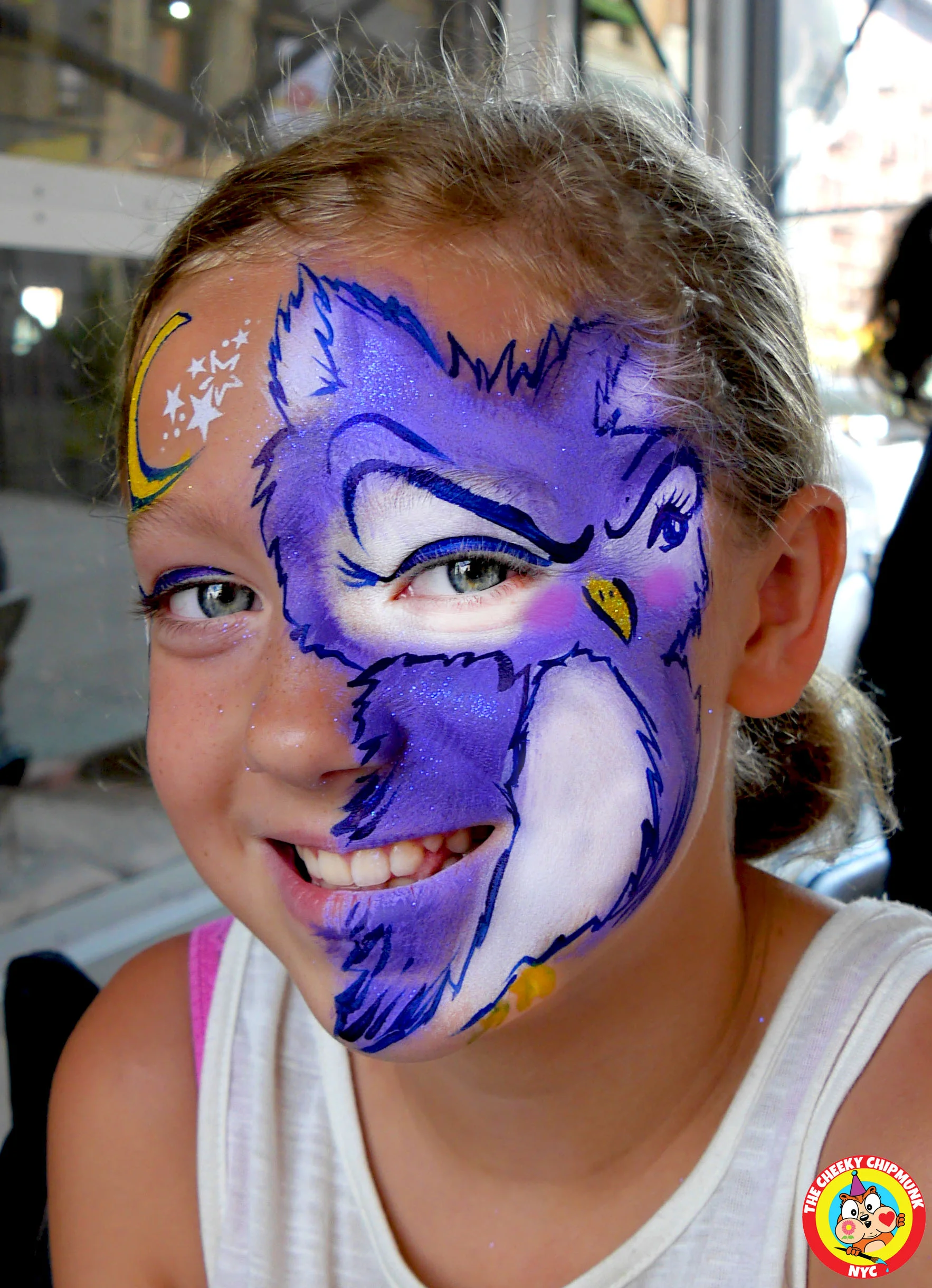 Owl with moon and stars face painting by Lenore Koppelman aka "The Cheeky Chipmunk" in NYC