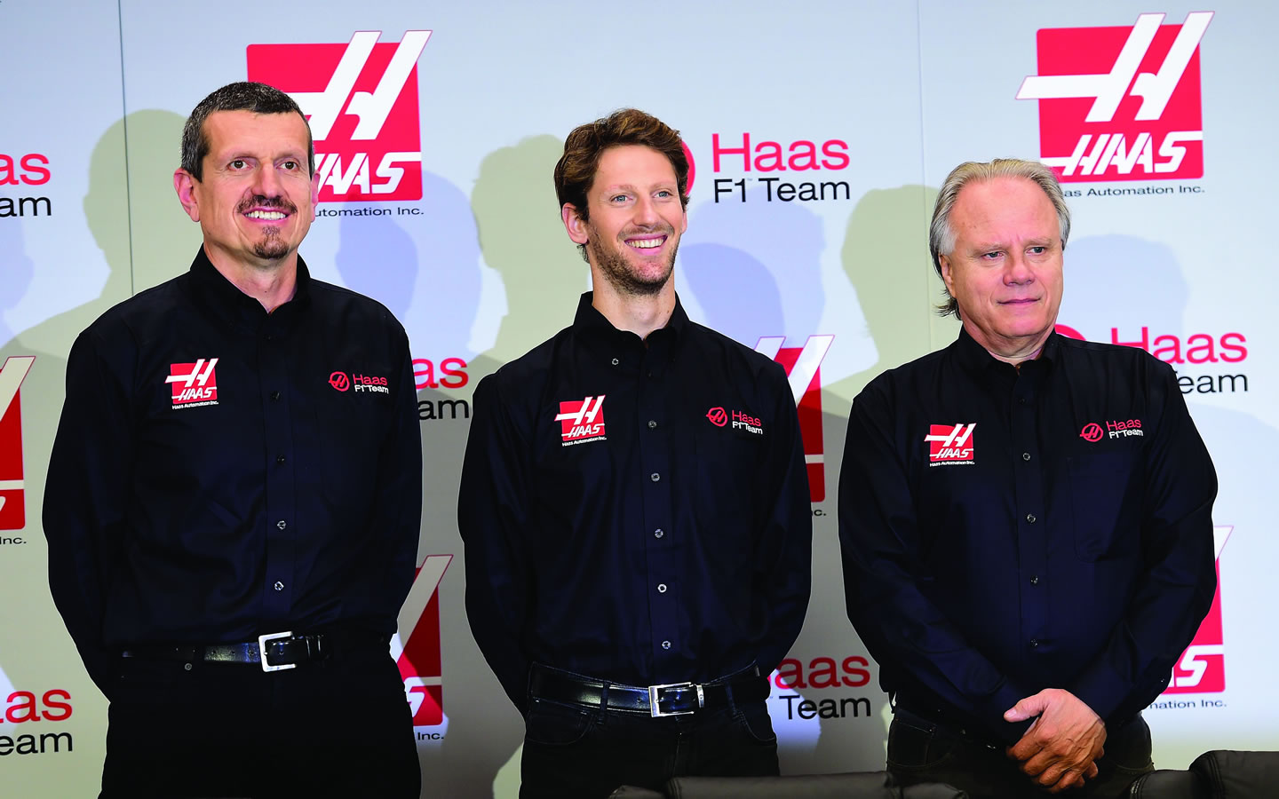 Gunther Steiner, team principal of Haas F1 Team, Romain Grosjean of France, and Gene Haas, owner of Haas F1 Team