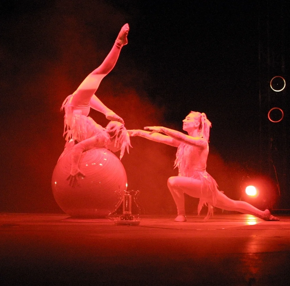 Katya (left) captioned performing with her mother Irina in Europe.