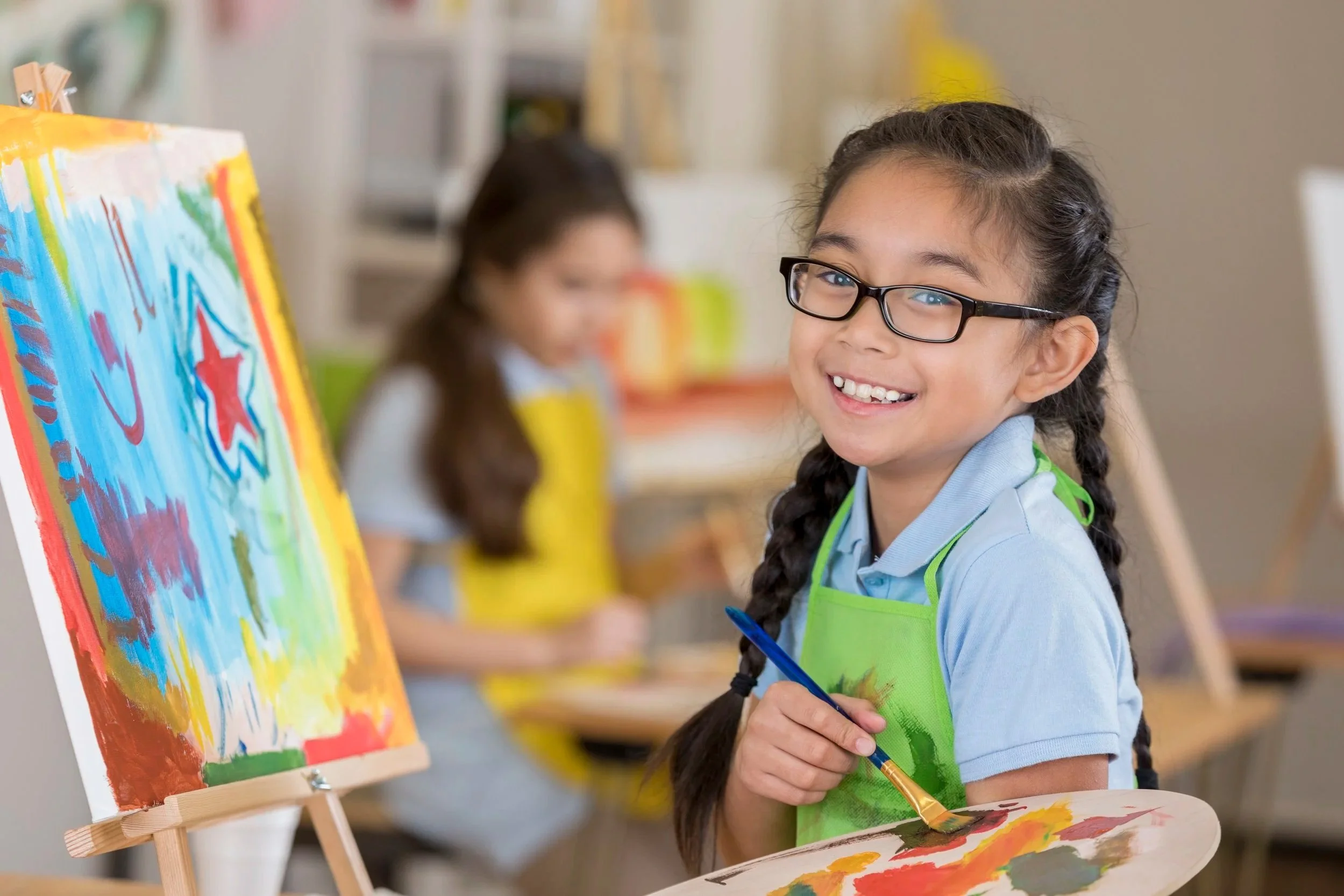 iStock-646498390, girl painting summer flyer 2018.jpg