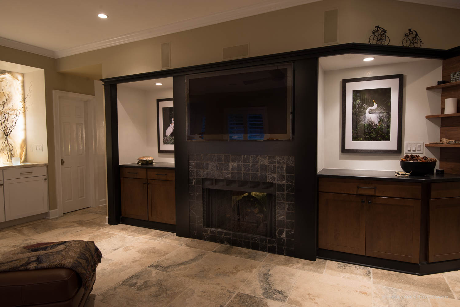 Great Egrets are to the left and the right of the TV. The one on the right is a male, displaying tail feathers.