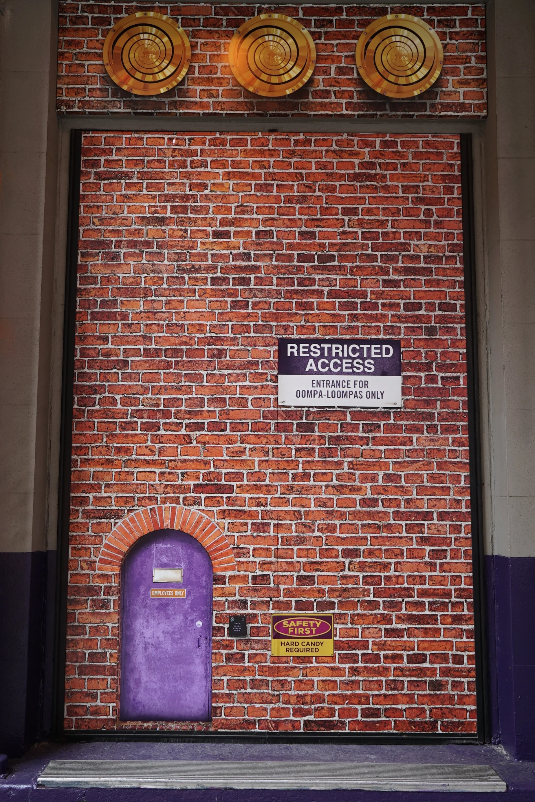 This is my favorite Easter Egg - the Oompa-Loompa-sized Employees Entrance. It immediately became a photo-op for passersby.