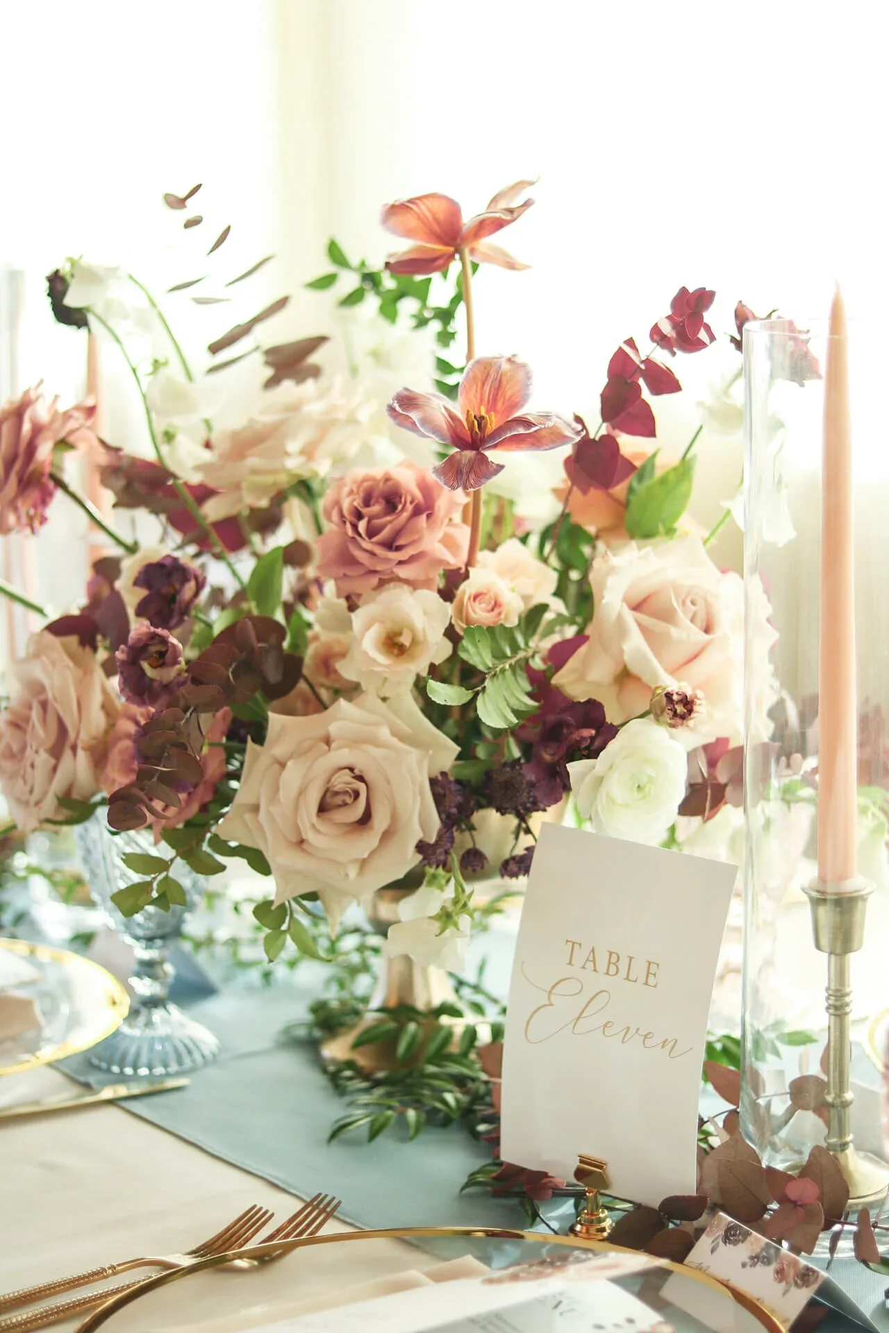 Soft romantic reception centerpiece flowers by an Austin florist.jpg.webp